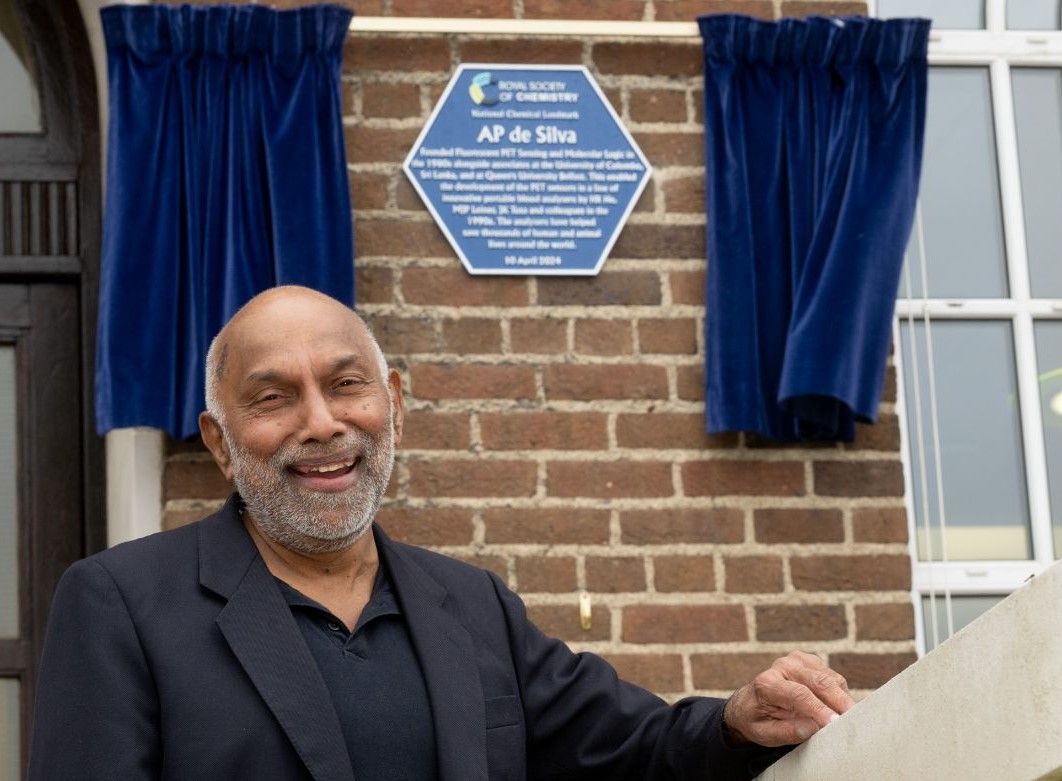 Prof AP de Silva in front of his plaque